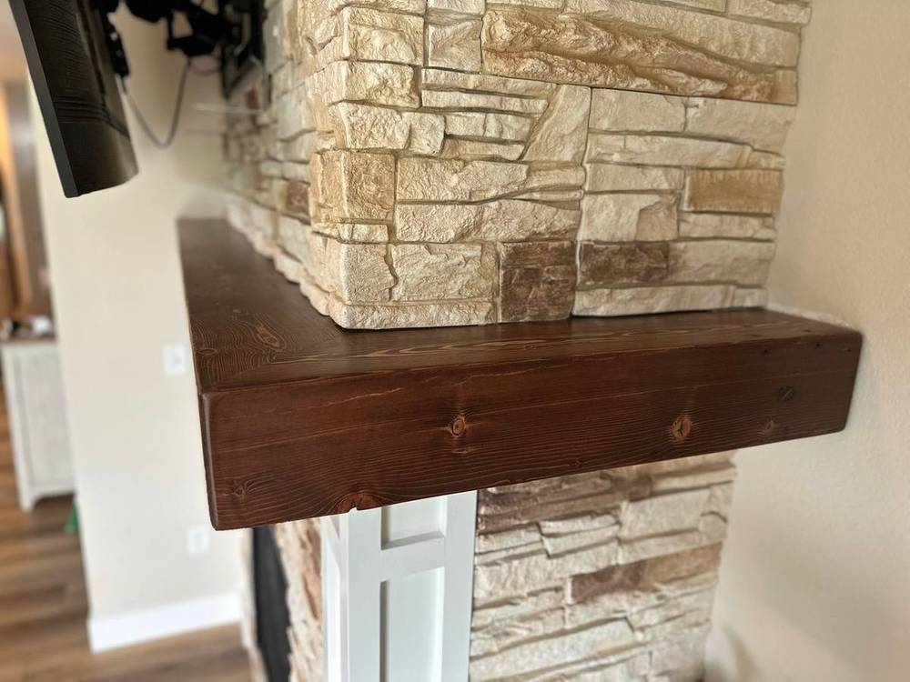 Corner detail of a reclaimed beam mantel