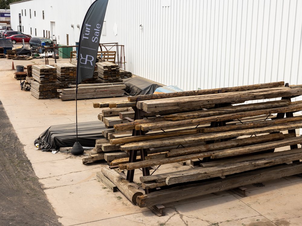 Racks of reclaimed timber lined up outside the warehouse on South Jason Street