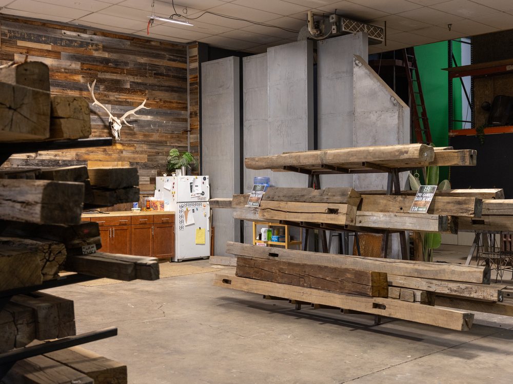 Inside the warehouse — beams, slabs and steel racked along the aisle