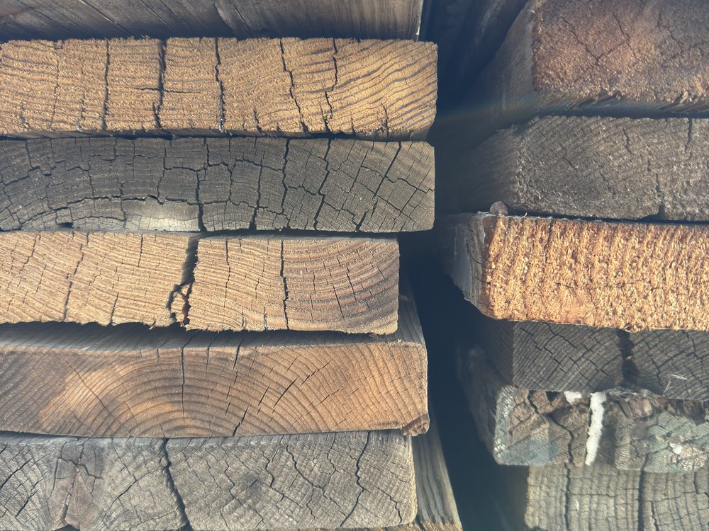 Close view of cut ends in the speedway bleacher stack, growth rings and drying checks running through the fir